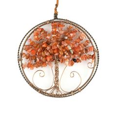 a tree of life ornament is shown with many beads in it's center