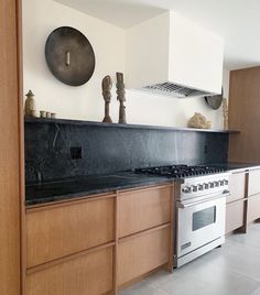 a kitchen with an oven, stove and cabinets inside of it's center island