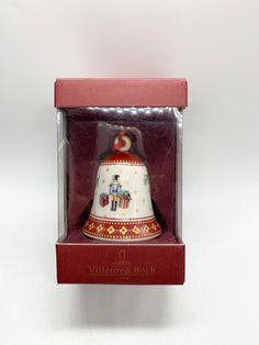 a red box with a white and gold bell in it