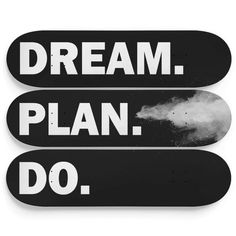 two black and white skateboards with the words dream plan do