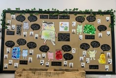 a bulletin board with pictures and writing on it that has an owl in the middle