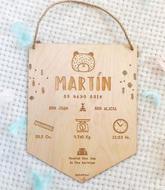 a wooden sign that says martin on it and features pictures of things around the world