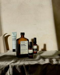 an assortment of skin care products sitting on a table