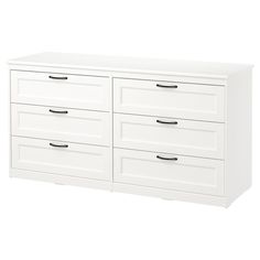 a white dresser with four drawers and two doors