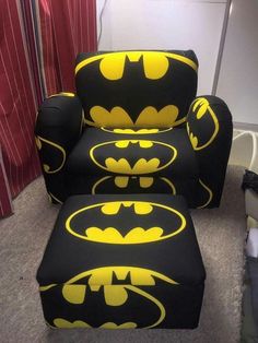 a batman chair and ottoman with the bat symbol on it