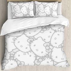 an image of a bed with hello kitty comforter and pillowcases on it