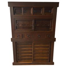 an old wooden cabinet with many drawers