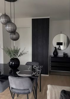 a modern dining room with black and white decor