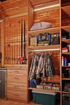 the inside of a fishing room with lots of fish rods