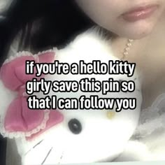 a woman holding a hello kitty stuffed animal in her lap with the caption if you're a hello kitty girl, save this pin so that i can follow you