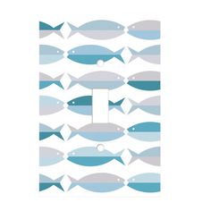 a light switch cover with blue and grey fish on it