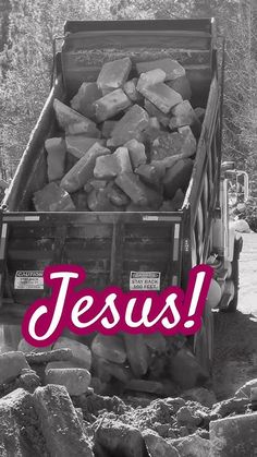 a truck full of rocks with the words jesus on it's side in black and white