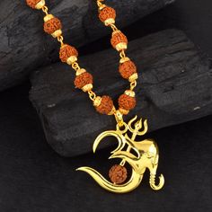 This listing is for 1 piece. At wholesale price Beautiful Lord Ganesha Pendant With Rudraksha  beads. These beautiful one of the most popular styles in the World .Chain With Lord GaneshaPendant Indian Hindu Idols Blessing idol Ganesha , best gifting unisex jewelry from India Make excellent gifting and collectible pieces(gift for birthday, wedding, anniversary) Photography & Colors Due to the fact that we photograph each of our items, some items may seem larger than the actual size and the colors may seem off as well, please make sure to read the dimensions in order to avoid problems that can be easily taken care of. We do our best to photograph the items with as much detail as possible, however, images can deceive the eye, again - feel free to reach us with any questions or concerns! For M Wedding Anniversary Photography, Hindu Idols, God Pendant, Ganesh Pendant, Ganesha Pendant, Anniversary Photography