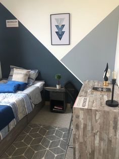 a bed room with a neatly made bed next to a night stand