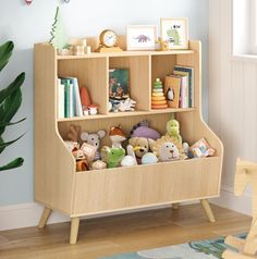 a wooden book shelf with stuffed animals and books on it in a child's room