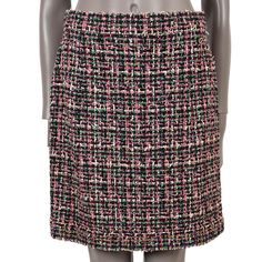 100% authentic Chanel below-knee tweed skirt in pink, black, green, blue and yellow polyamide (55%), polyester (14%), viscose (11%), cotton (10%), wool (6%) and polyurethane (4%). Lined in black silk (100%). The hem is embellished with gold, silver, pink and blue beads. Opens with a zipper on the back. Has been worn and is in excellent condition. Please note: Skirt got altered by Chanel and fits now a size FR 40. Measurements Model 19P P60850 V46091 MF773 Tag Size 42 (fits like a size FR 40) Siz Rose Noir, Tweed Mini Skirt, Tweed Skirt, Chanel Black, Pink Cotton, Blue Beads, Black Silk, Black Green, A Line Skirts