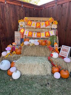 an outdoor birthday party with hay bales and pumpkins