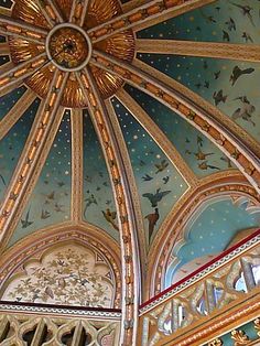 an ornate ceiling in the middle of a building