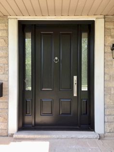 a black front door with two sidelights