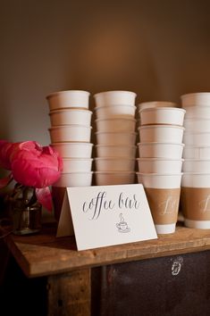 coffee cups are lined up on a table