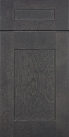 an image of a kitchen cabinet door with dark woodgrain and white trimming