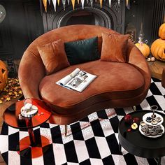 a living room decorated for halloween with pumpkins and black and white checkered flooring