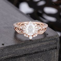 a rose gold engagement ring with an oval cut diamond