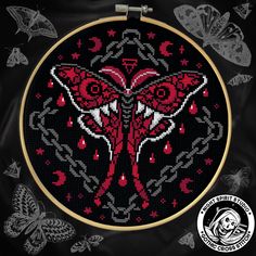 a cross - stitch pattern in red and black with butterflies on the background, which includes an image of a butterfly