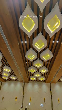 the ceiling is decorated with white and yellow lights