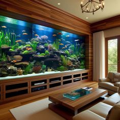 a living room filled with furniture and an aquarium in the middle of it's wall