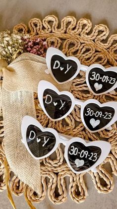 five black and white heart shaped magnets with the words diy on them