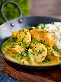 a bowl filled with rice and chicken curry