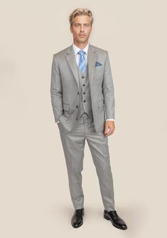 Elevate your wardrobe with our premium Glacier Grey Twill Suit. Cut from luxurious, Super 110s 100% merino wool by Vitale Barberis Canonico; this custom-made suit exudes sophistication and classic style. Perfect for any occasion, its versatility will easily take you from day to night. Luxury Fitted Single Breasted Three-piece Suit, Luxury Fitted Single-breasted Three-piece Suit, Wedding Three-piece Suit With Welt Pockets, Timeless Slim Fit Wool Suit, Fitted Wool Three-piece Suit In Timeless Style, Timeless Fitted Wool Three-piece Suit, Elegant Fitted Single-breasted Sets, Elegant Tailored Tuxedo With Flat Front, Wool Tailored Blazer For Wedding