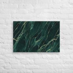 a green marble wall hanging on a white brick wall