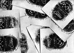 black and white photograph of several business cards with the word, c & s on them