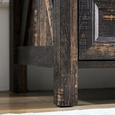 a close up view of an old wooden table with wood grains on the floor