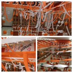 orange and white streamers are hanging from the ceiling in this school hallway decorated for halloween