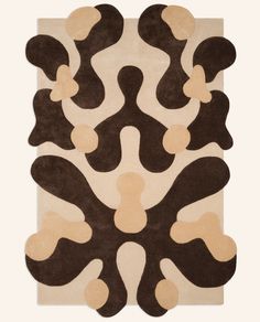 a brown and white rug with an abstract design on the bottom, in front of a white background