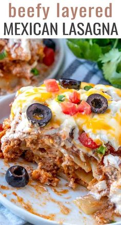 this beef layered mexican lasagna is loaded with cheese, black olives and tomatoes