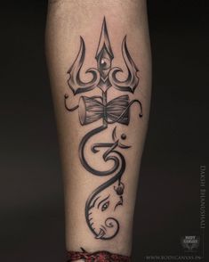 a tattoo on the leg of a person with an elephant and book in it's hand