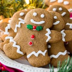 some very pretty decorated ginger cookies on a plate