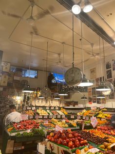 an open market with lots of fresh fruits and vegetables