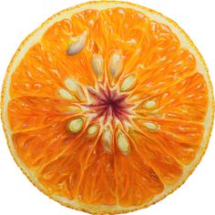 an orange cut in half with seeds on it's end and the center section