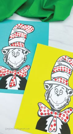 two dr seuss and the cat in the hat cards on a table with green cloth