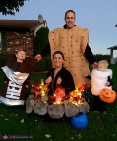 a family dressed up in costumes for halloween