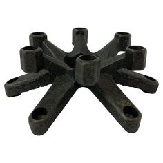 black cast iron pipe clamps with holes in the middle on a white background