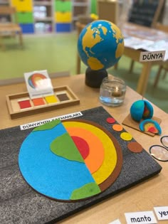 the table is set up with different items for children's learning to learn colors and shapes