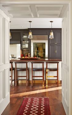 an open kitchen and dining room with hardwood floors