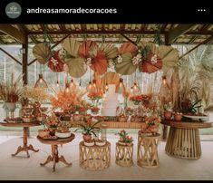 there are many decorations on the table in this room, including umbrellas and flowers