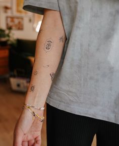 a person with a small tattoo on their arm